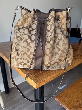 Coach Signature Canvas Drawstring Shoulder Bag in Brown and Tan
